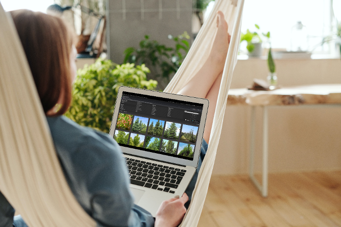 Woman using MacBook Air while sitting in the hammock_2023-03-20_15-09-00-1-1
